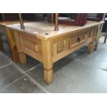 A pine coffee table with drawer