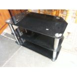 A black glass TV stand