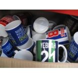 A large box of various mugs