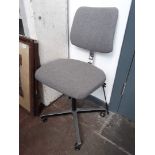A grey retro Avon desk swivel chair.