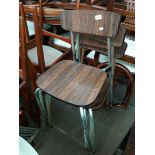 A set of four Turan stacking dining chairs.