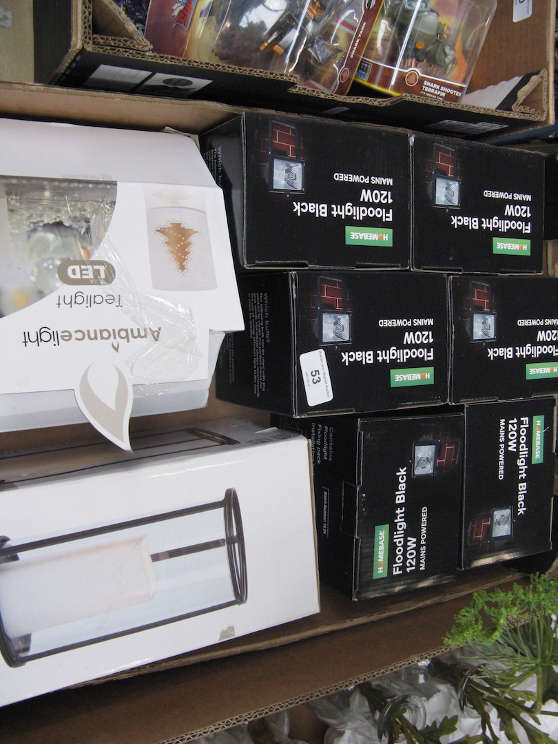 A box containing 120W floodlights and tealights