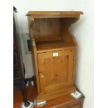 A pine bedside cupboard