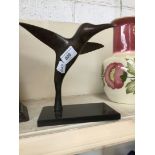 A bronze figure of a humming bird on a plinth - Lancashire Business Awards