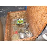 wicker hamper containing various brass plaques and some pewter ware