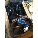 Box of cameras and binoculars