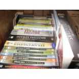 A box of books and DVDs related to steam trains
