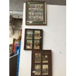 Framed cigarette cards, and two framed postcard pictueres