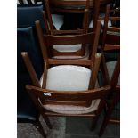 A set of four Nathan teak dining chairs.