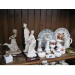 Shelf of china ornaments, figures and plates
