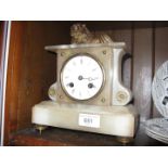 A French late 19th century alabaster mantel clock with lion finial, height 22cm.