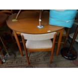 A Nathan teak extending table and four chairs.