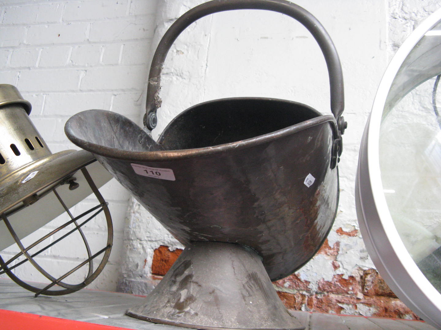 A copper coal scuttle