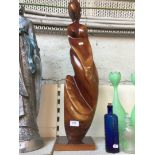 A wooden nude lady figure