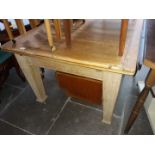 A scrub pine drawer leaf table on oak legs