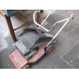 A Flymo petrol lawn mower