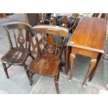 A drop leaf table and 4 chairs