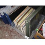A crate and a case of vinyl LPs