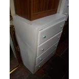 A white painted chest of 4 drawers