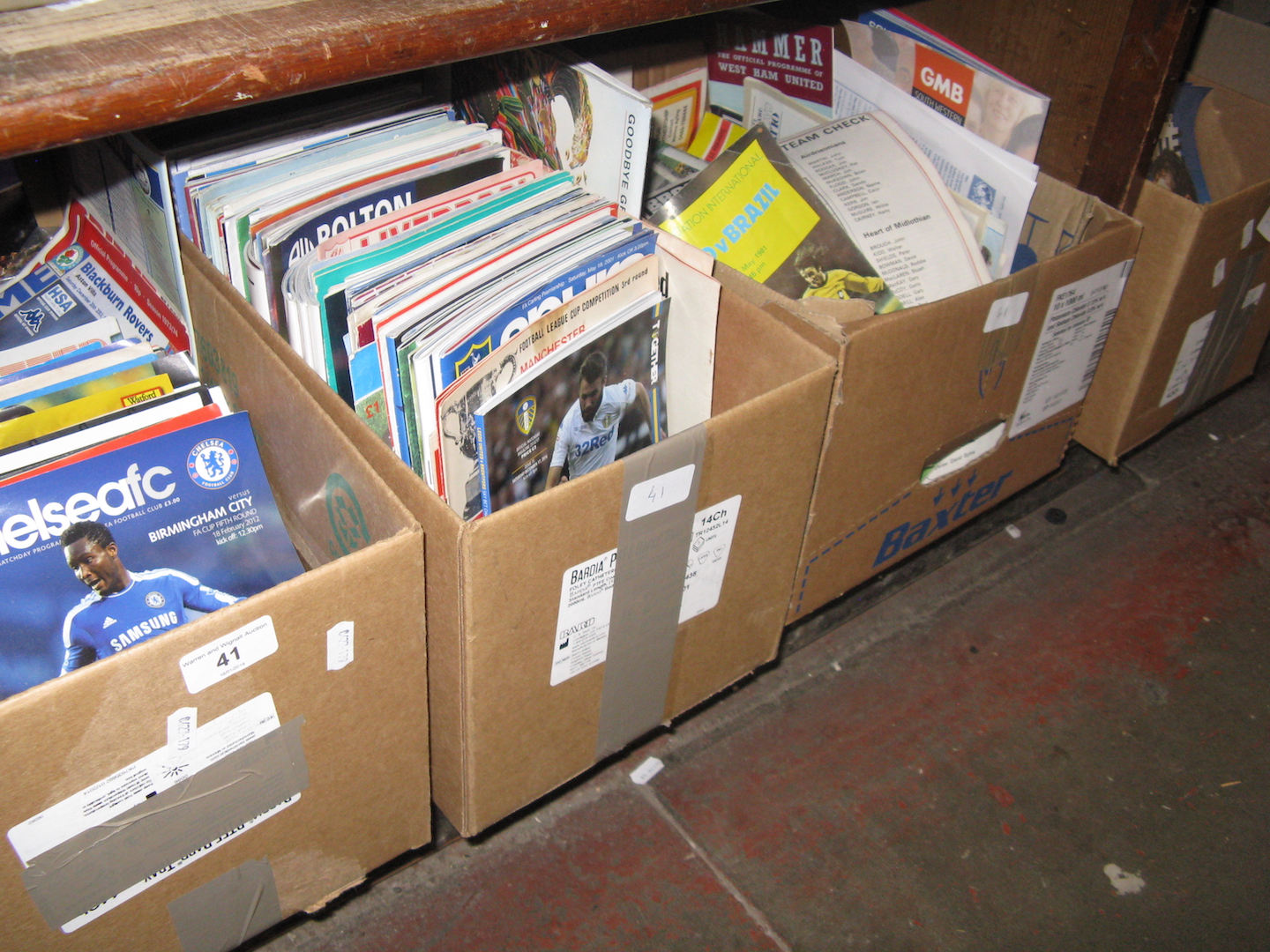 4 boxes of football programmes