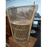 A wicker tub chair