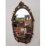 A small gilt metal framed mirror