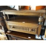 An Ercol Elm cabinet with corner drop leaf