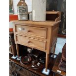 A stripped and wax pine wash stand