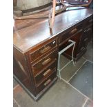 A 1920s oak pedestal desk