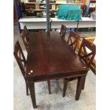 A rustic style dining table with 6 chairs