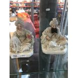 Two porcealin figure candle holders