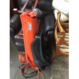 An electric Flymo garden vac