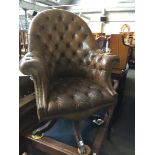 A Chesterfield buttoned leather captain's chair