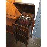 A gramaphone in oak cabinet