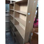 A pair of wood effect open bookcases