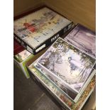 2 boxes of jigsaws