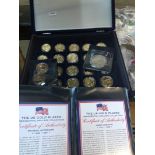 A box with collection of gold plated dollar coins