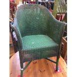 A garden green Lloyd Loom chair