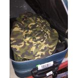 A suitcase with army uniforms