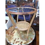 A glass top cane table