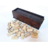 A 19th century set of bone dominoes with wooden case.