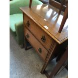 An oak chest of two drawers