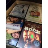 A box of DVDs mainly movies