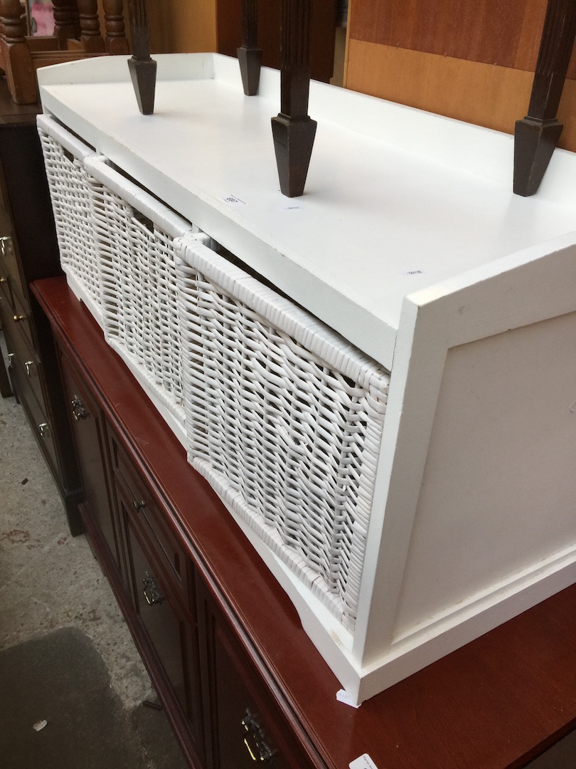 A white and wicker drawer unit