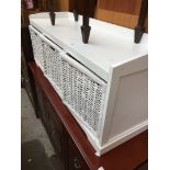 A white and wicker drawer unit