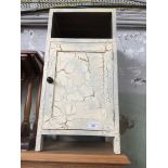 A shabby chic painted bedside cabinet.