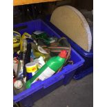 A box of storage plastic boxes and a darts board