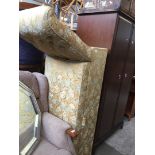 A yellow/gold damask upholstered ottoman