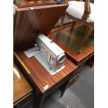 Singer sewing machine in cabinet