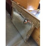 A gilt framed mirror